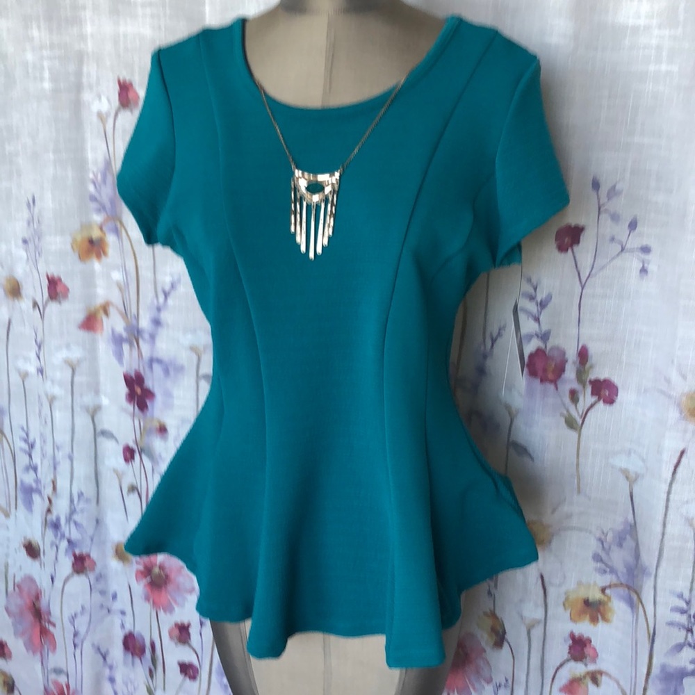 Teal/blue peplum top beautiful for shaping the torso